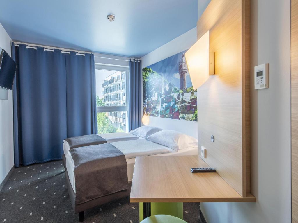Postel nebo postele na pokoji v ubytování B&B Hotel Neu-Ulm
