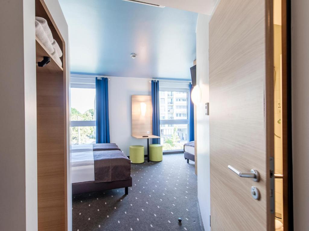 Postel nebo postele na pokoji v ubytování B&B Hotel Neu-Ulm