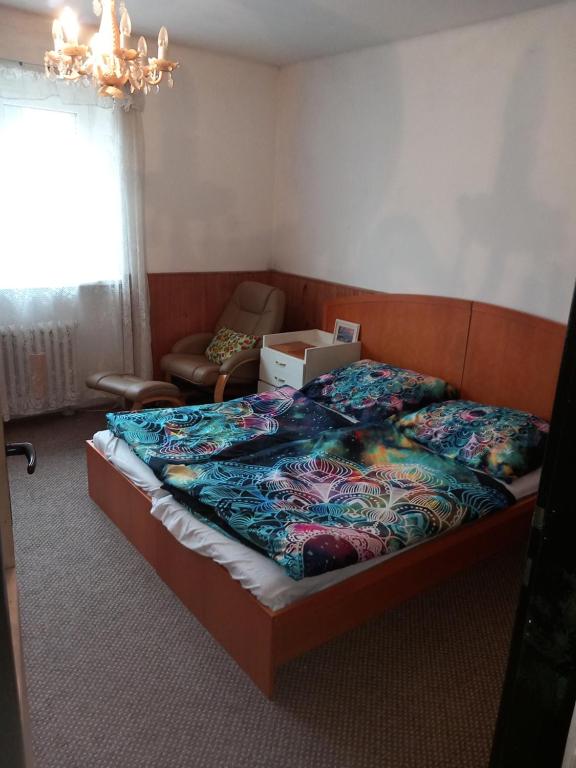 a bedroom with a bed with a box on it at Apartment in the city of Pilsen in Božkov