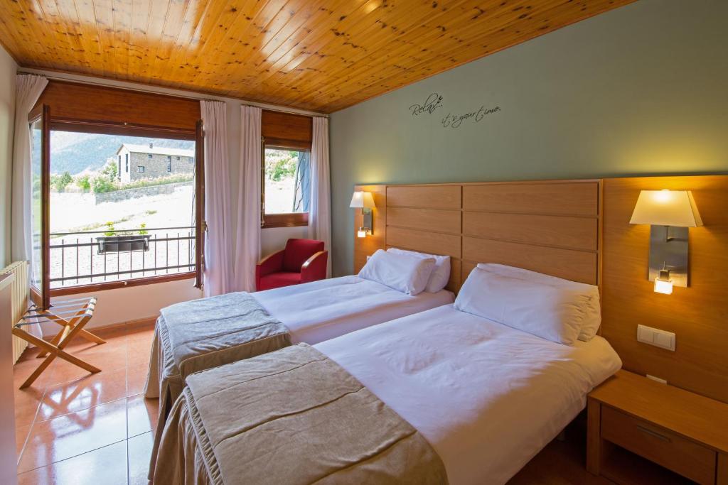 Postel nebo postele na pokoji v ubytování Pierre & Vacances Aparthotel La Tulipa