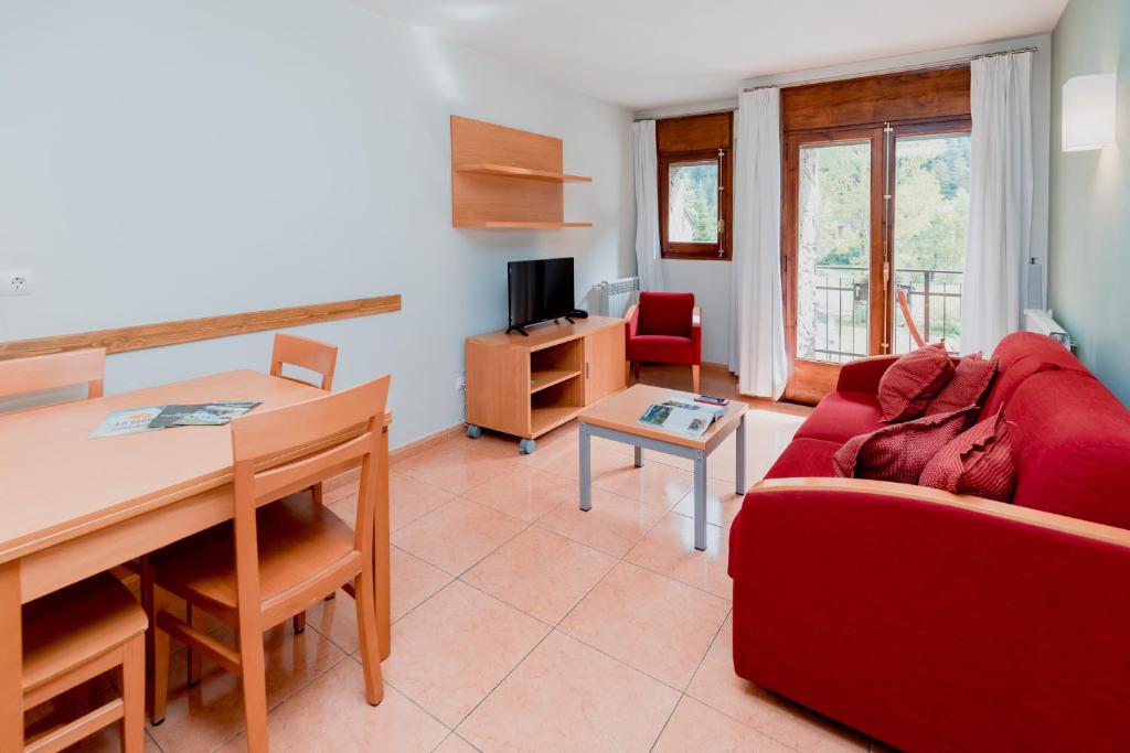 TV a/nebo společenská místnost v ubytování Pierre & Vacances Aparthotel La Tulipa