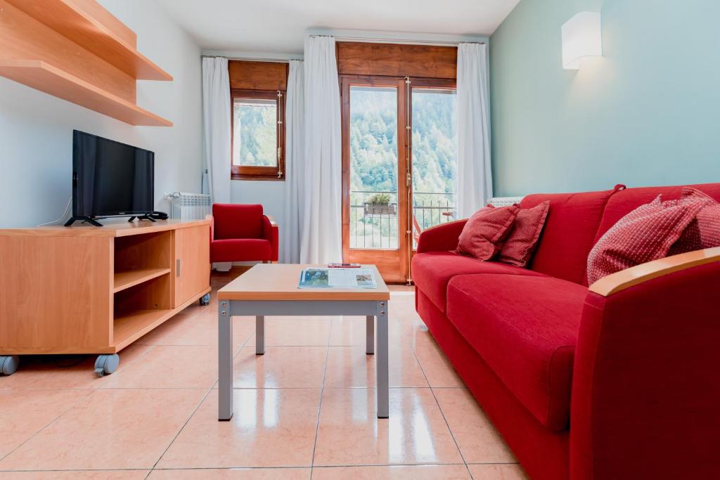 TV a/nebo společenská místnost v ubytování Pierre & Vacances Aparthotel La Tulipa