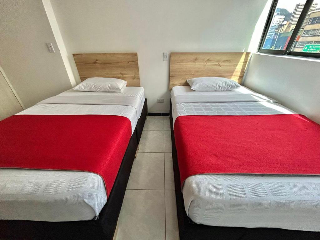 Postel nebo postele na pokoji v ubytování Hotel Urban Center Bogota