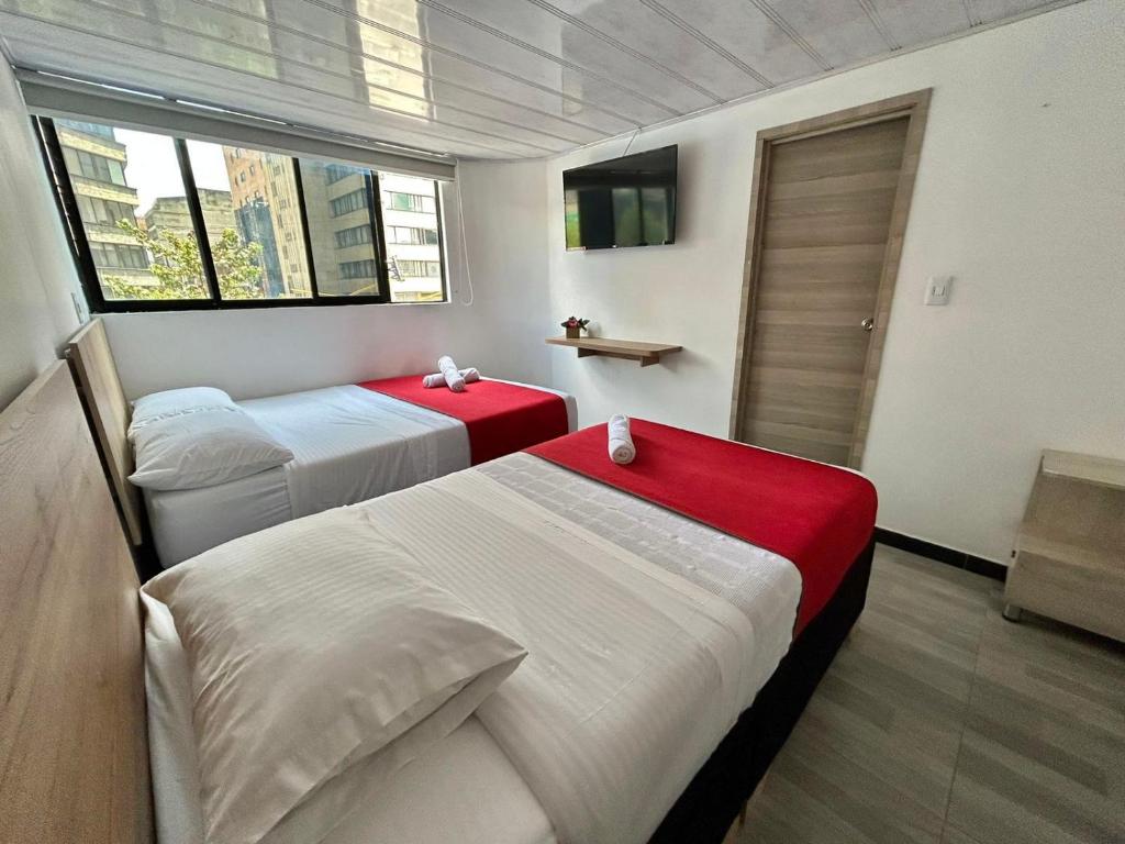 Postel nebo postele na pokoji v ubytování Hotel Urban Center Bogota