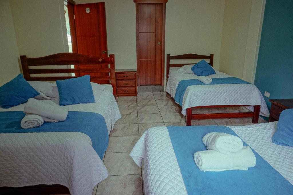 Postel nebo postele na pokoji v ubytování Hostal CañaLimeña