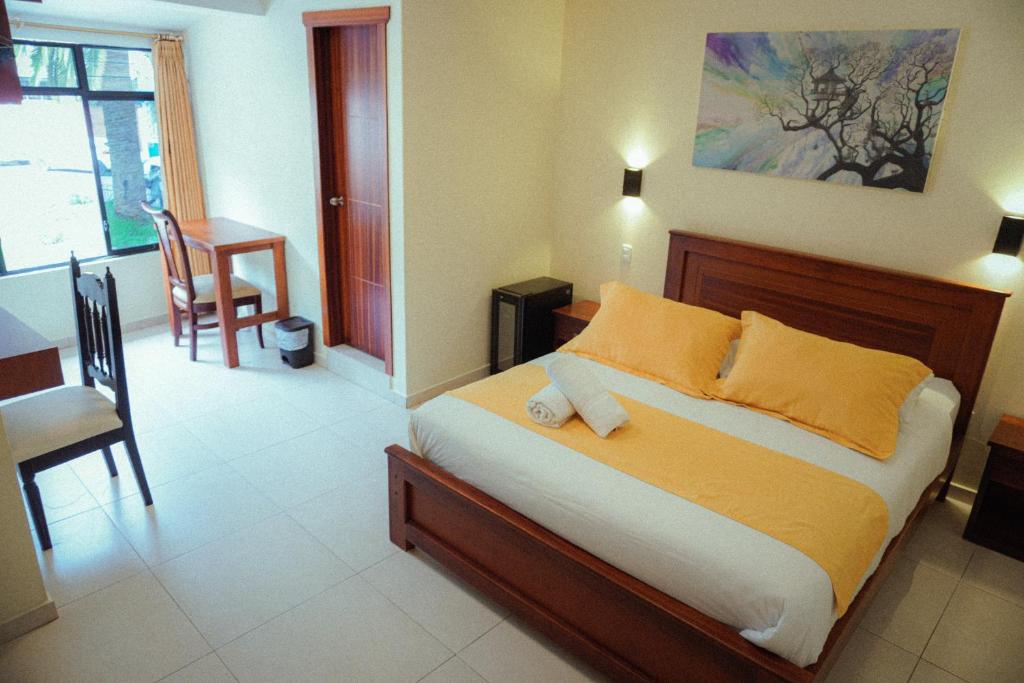 Postel nebo postele na pokoji v ubytování Hostal CañaLimeña