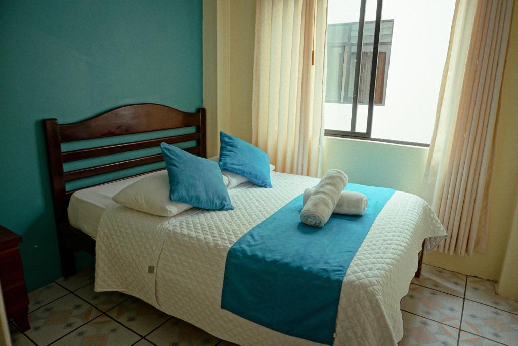 Postel nebo postele na pokoji v ubytování Hostal CañaLimeña