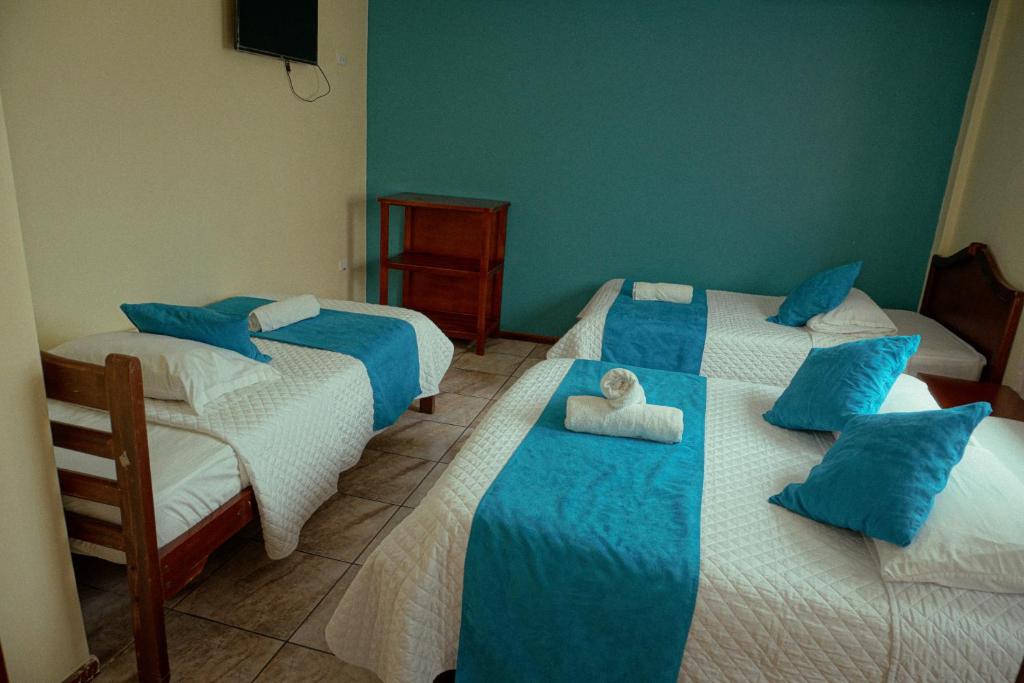 Postel nebo postele na pokoji v ubytování Hostal CañaLimeña