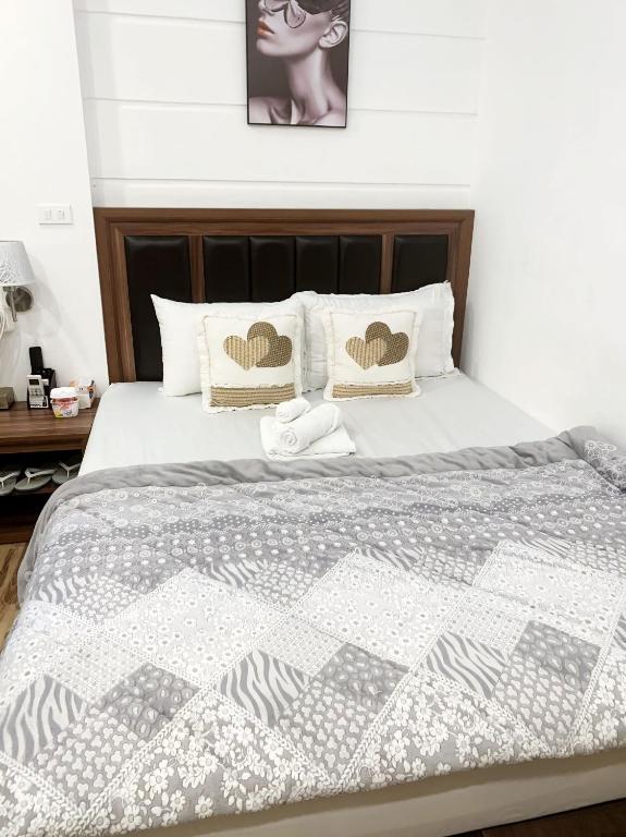 Postel nebo postele na pokoji v ubytování GRAD Dai Thanh Motel