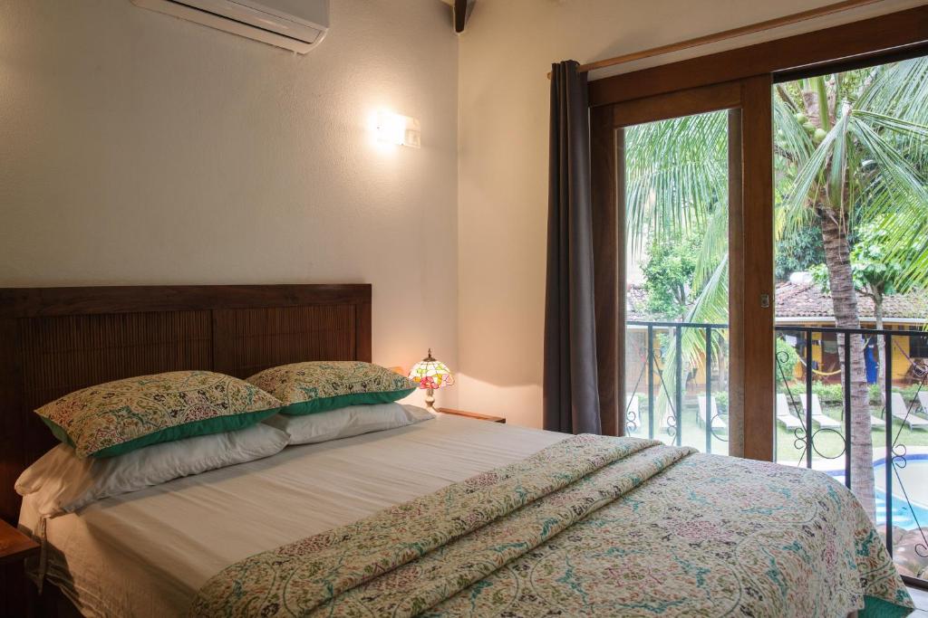 Postel nebo postele na pokoji v ubytování Villas Macondo