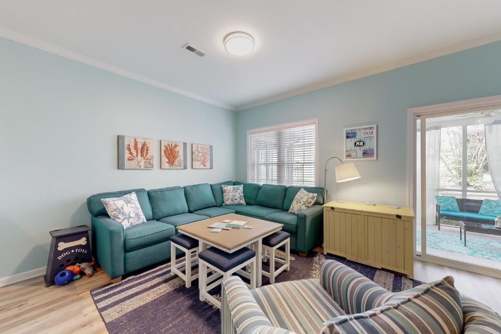 a living room with a couch and a table at Oyster Bay Villas --- 20411 Jeb Dr, Unit #36 in Rehoboth Beach