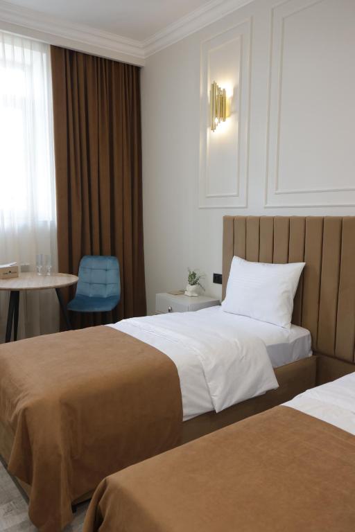 Postel nebo postele na pokoji v ubytování Parvana Guest House