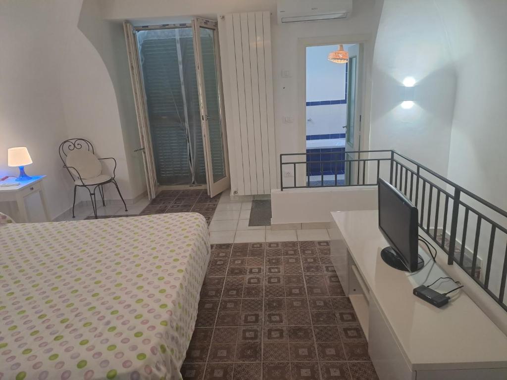 Postel nebo postele na pokoji v ubytování DreamHouse Nonno Enio - Forio d'Ischia