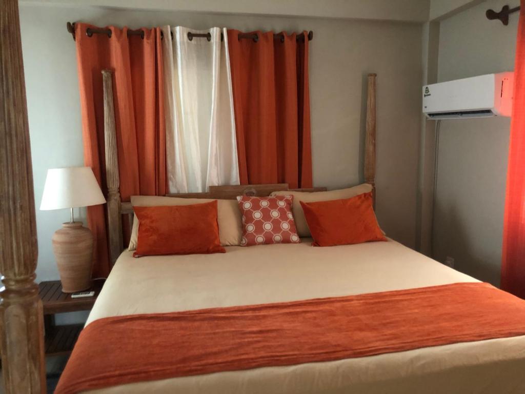 Postel nebo postele na pokoji v ubytování Atlantic Breeze Apartments, Canouan Island