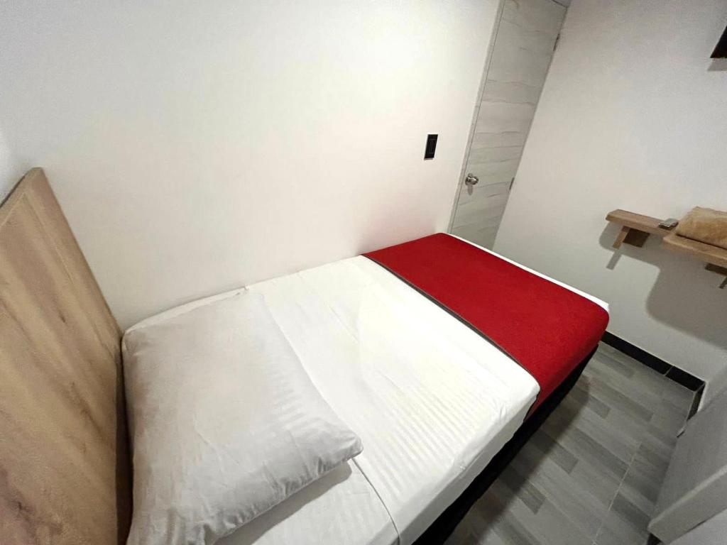 Postel nebo postele na pokoji v ubytování Hotel Urban Center Bogota