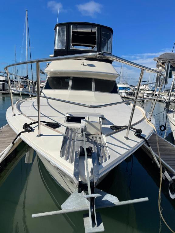 a white boat is docked at a dock at Private Yacht in San Francisco in San Francisco