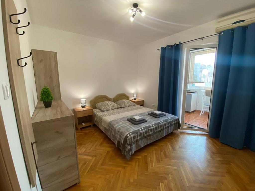 Postel nebo postele na pokoji v ubytování Alina's apartment