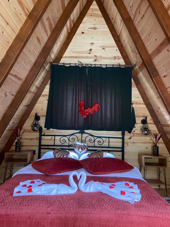 a bedroom with a bed in a attic at SezBungalov in Ardeşen