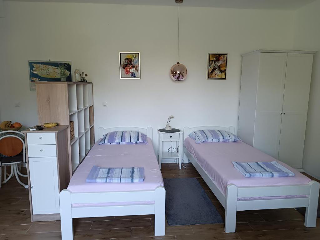 Postel nebo postele na pokoji v ubytování Anći