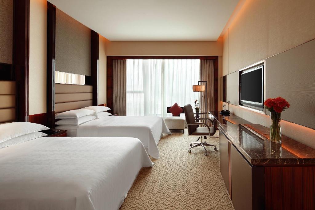 TV a/nebo společenská místnost v ubytování Sheraton Hefei Xinzhan Hotel