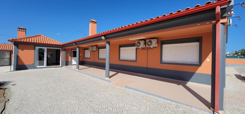 a rendering of a building with an empty parking lot at Alojamento Monte dos Patos in Setúbal