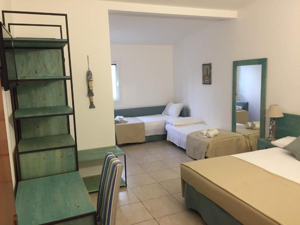Postel nebo postele na pokoji v ubytování Hotel Universo