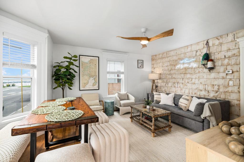 a living room with a couch and a table at A by the Bay - Stunning Seaside Apartment in Gloucester