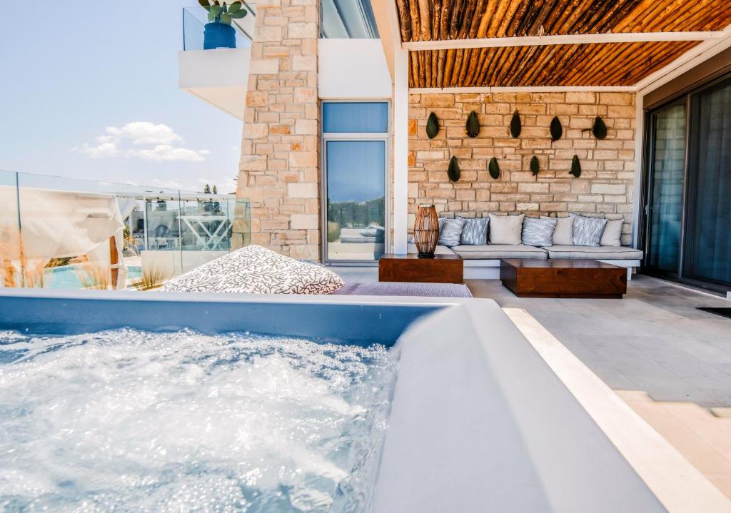 a hot tub in the backyard of a house at Made of Blue luxury suites collection in Rethymno