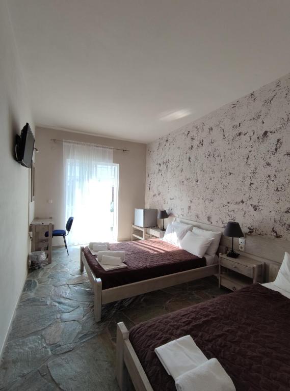 Postel nebo postele na pokoji v ubytování Ermis Hotels & Resorts