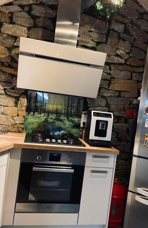 Kuchyň nebo kuchyňský kout v ubytování Un havre de quiétude au cœur des Montagnes