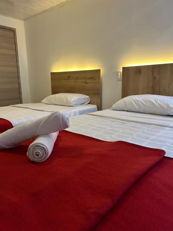 Postel nebo postele na pokoji v ubytování Hotel Urban Center Bogota