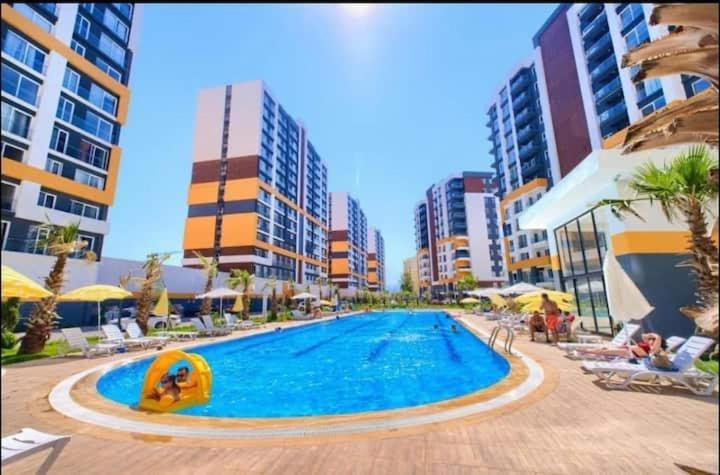 a swimming pool in the middle of a city at Flat in ekpa 1207 in Antalya