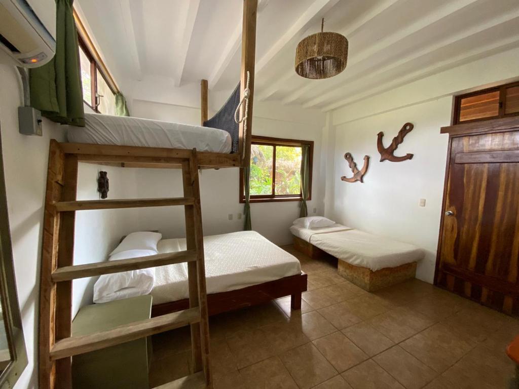 Postel nebo postele na pokoji v ubytování Hotel Nantu Hostería