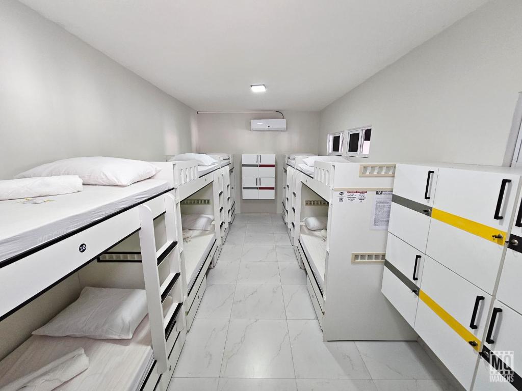 Postel nebo postele na pokoji v ubytování MANERO POUSADA e HOSTEL