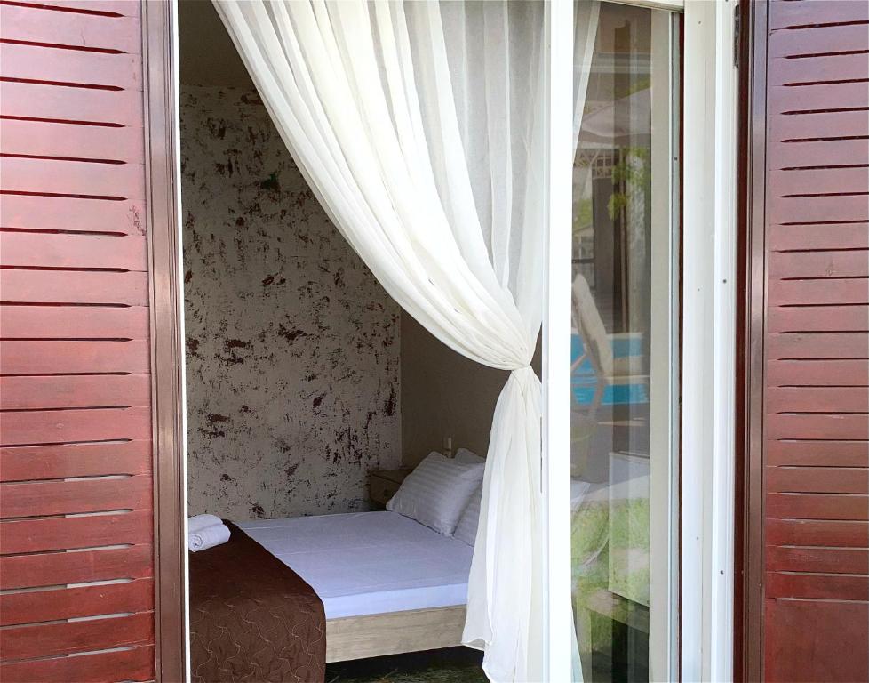 Postel nebo postele na pokoji v ubytování Ermis Hotels & Resorts