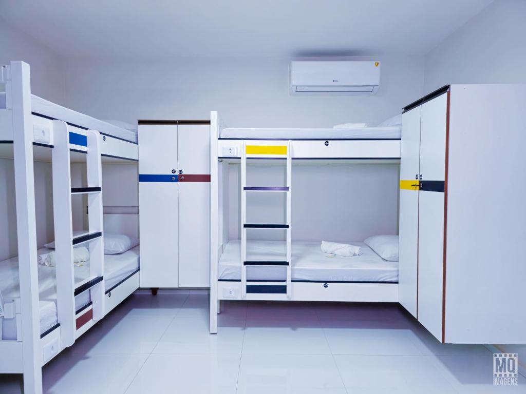 Postel nebo postele na pokoji v ubytování MANERO POUSADA e HOSTEL
