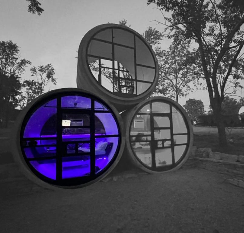 two circular windows with a blue light in them at Tube - 06 Lockridge Park in Danville