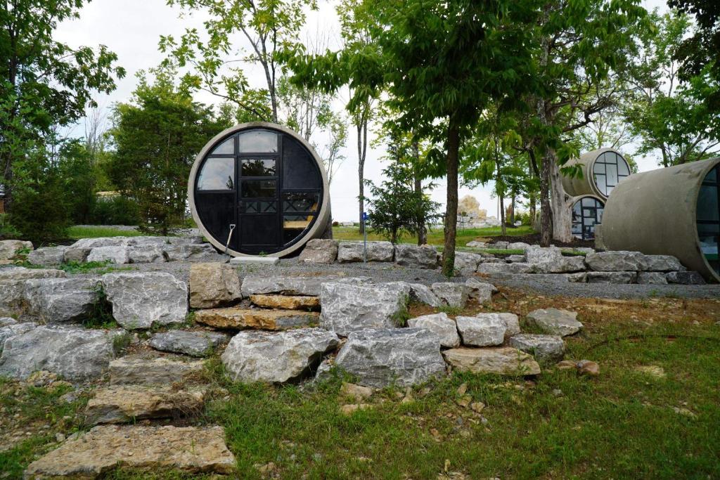 a building with a round window on a pile of rocks at Tube - 04 Lockridge Park in Danville