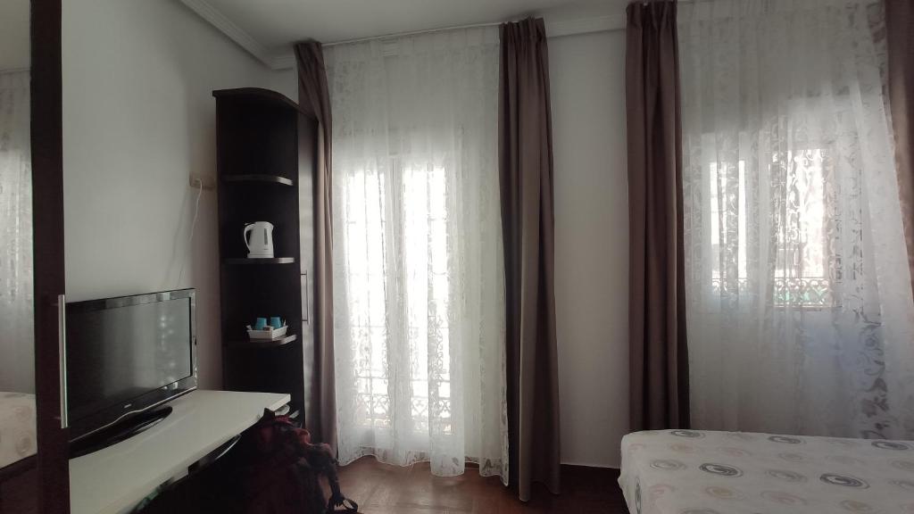 Postel nebo postele na pokoji v ubytování Dormir en Cádiz