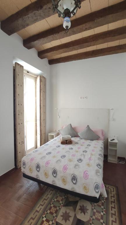 Postel nebo postele na pokoji v ubytování Dormir en Cádiz