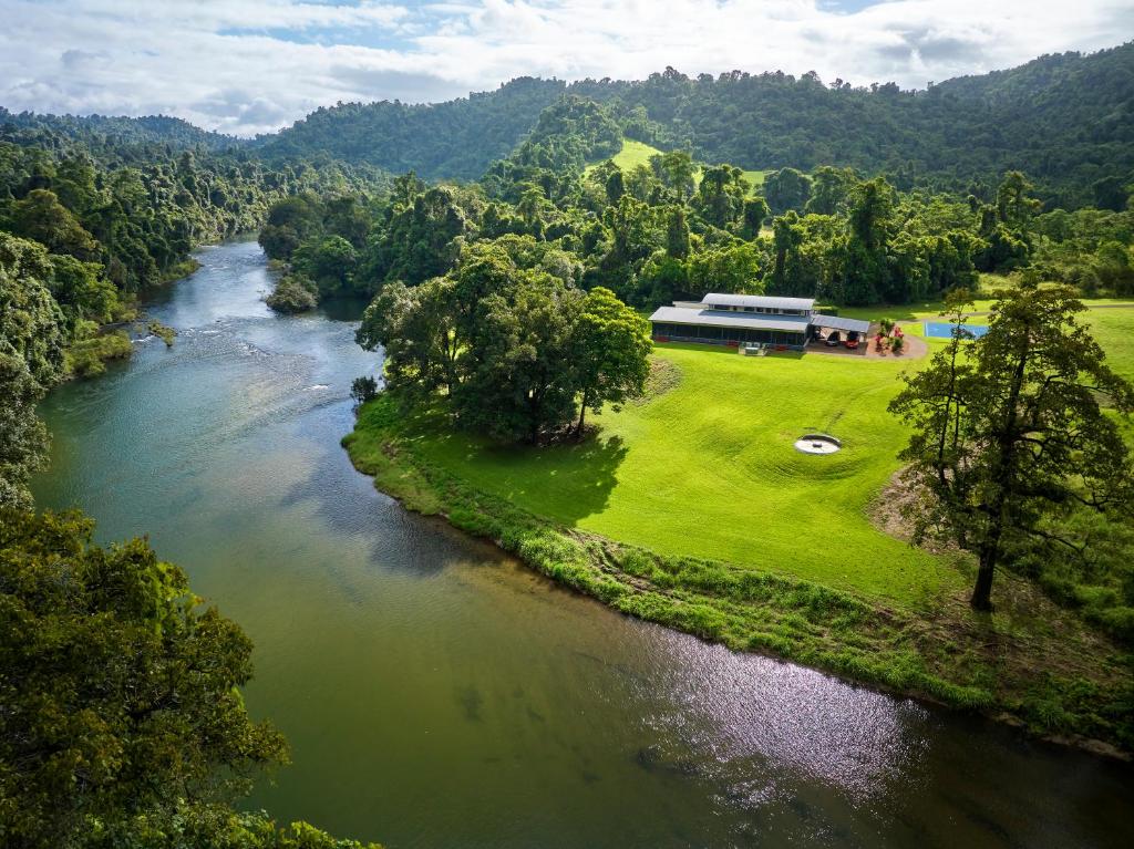 an aerial view of a river with a building next to it at Cinnamon House at Vanilla Club in Berner Creek