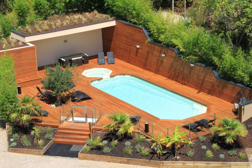 an overhead view of a swimming pool in a backyard at Hotel du Parc in Arcachon