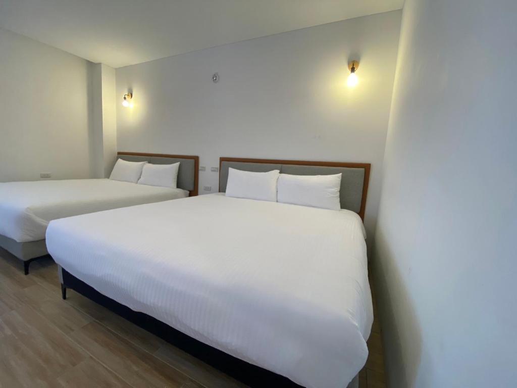 Postel nebo postele na pokoji v ubytování 浯島文旅WD Hotel