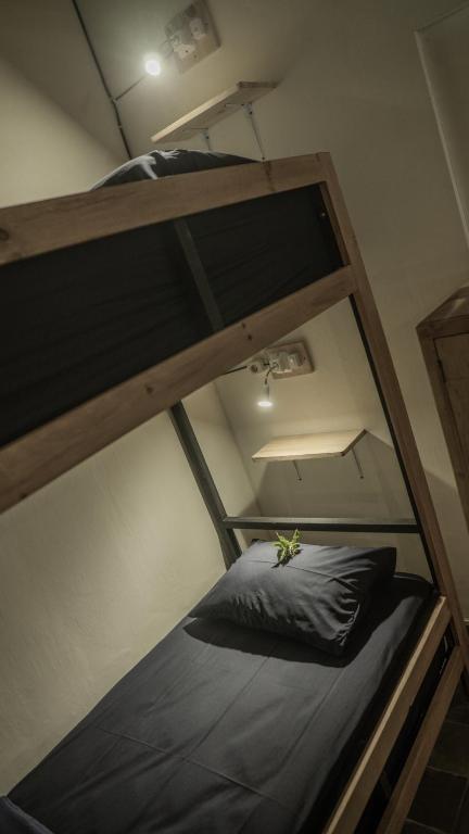Postel nebo postele na pokoji v ubytování Ranasa Yogyakarta
