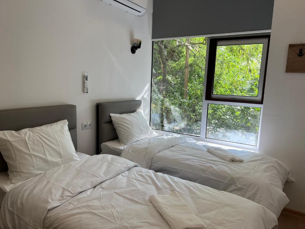 Postel nebo postele na pokoji v ubytování Apple cozy hotel