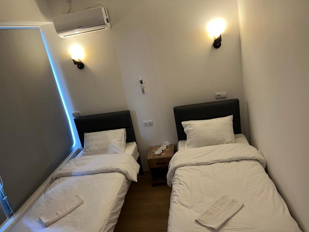Postel nebo postele na pokoji v ubytování Apple cozy hotel