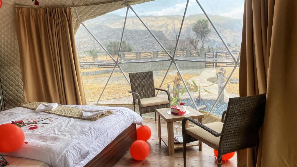 Postel nebo postele na pokoji v ubytování Jabal shams domes