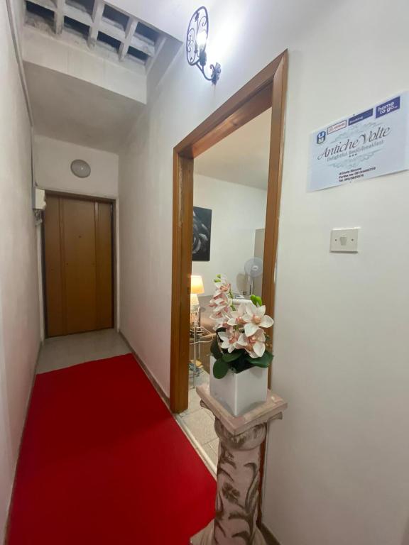 Postel nebo postele na pokoji v ubytování ANTICHE VOLTE di Doris Simone