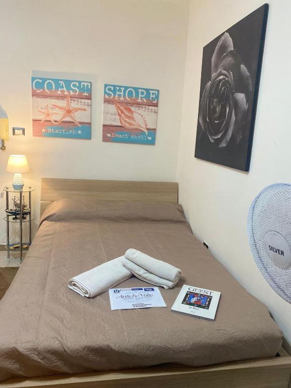 Postel nebo postele na pokoji v ubytování ANTICHE VOLTE di Doris Simone
