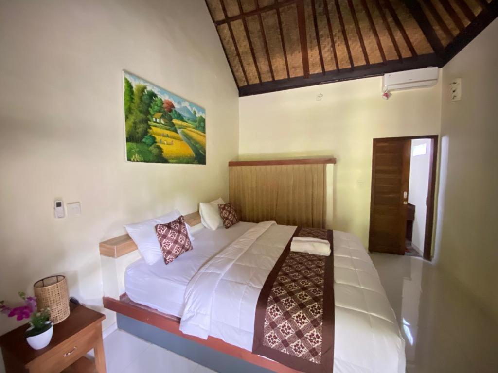 Postel nebo postele na pokoji v ubytování Pomelo Guest House